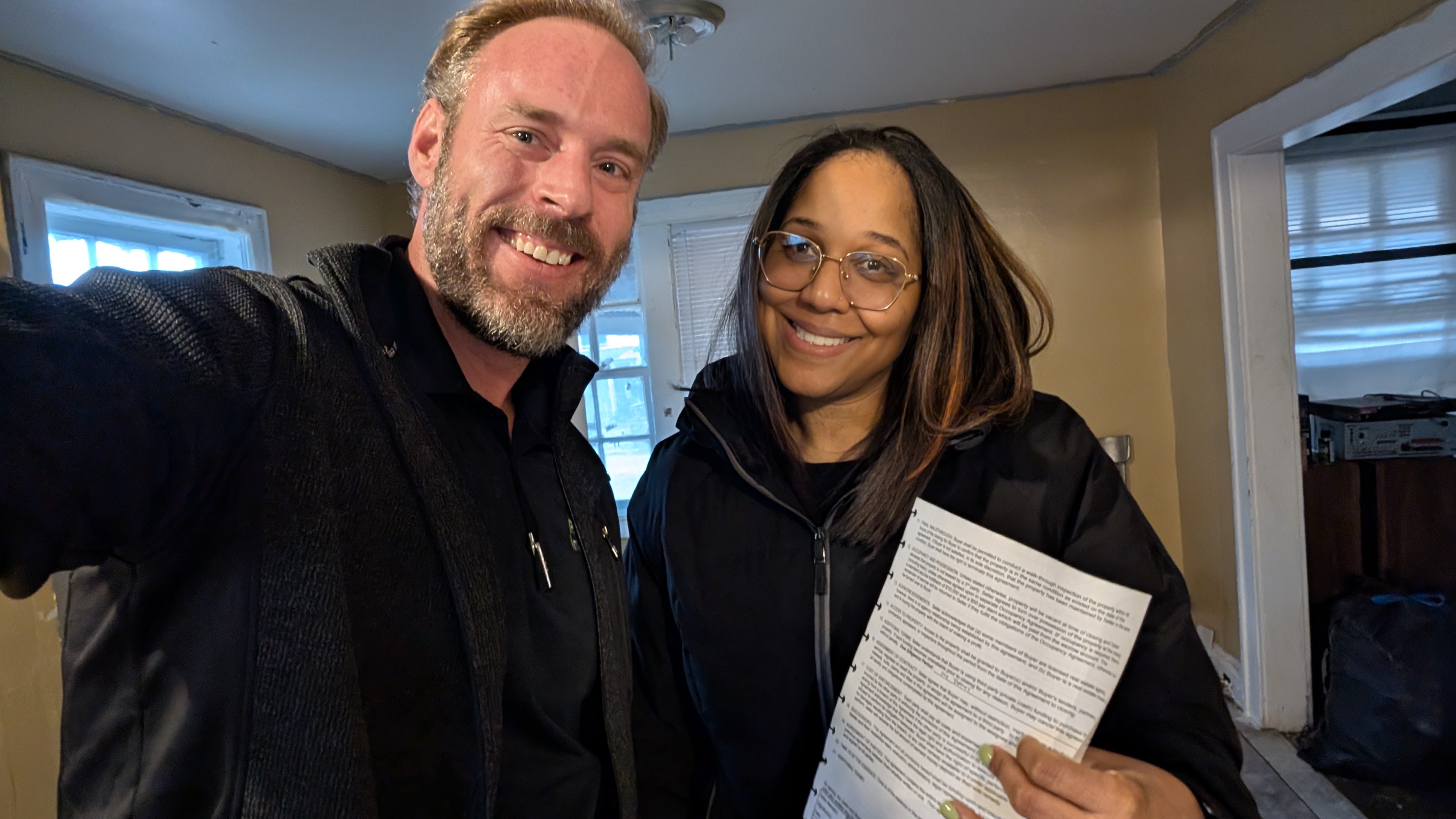 Mike with seller holding contract