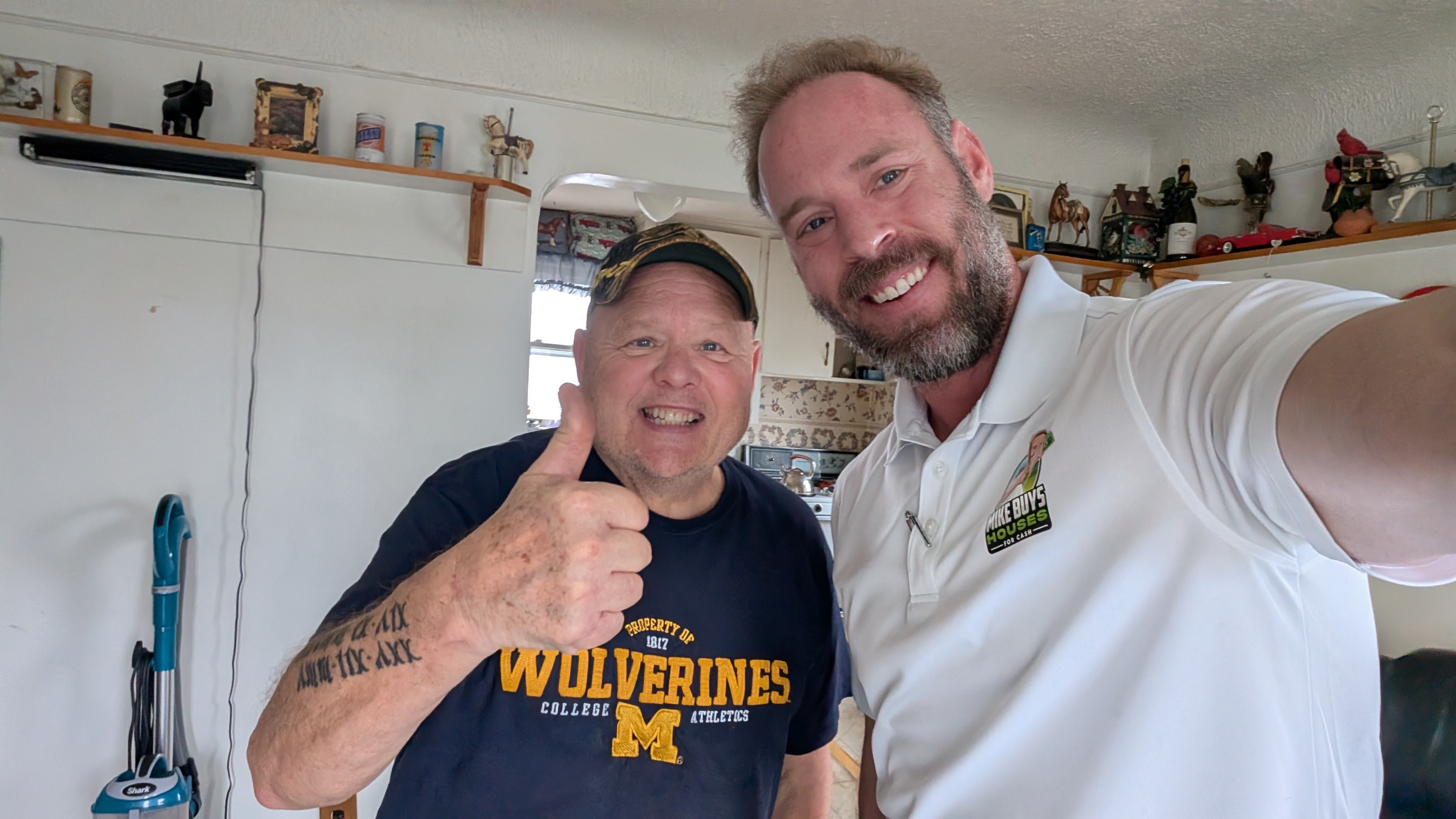 Mike with happy seller - thumbs up